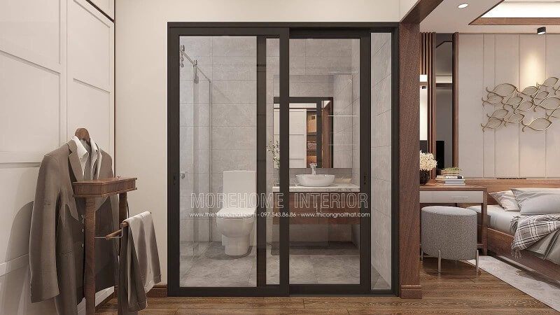 Bố trí nội thất phòng ngủ khép kín với xu hướng mở khi sử dụng tấm ốp tường gỗ óc chó như tạo ranh giới phân chia cùng bố trí cửa kính trượt.